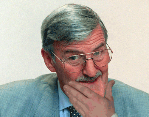 Animation gif of English TV sports presenter Jimmy Hill looking a little sceptical while stroking his chin